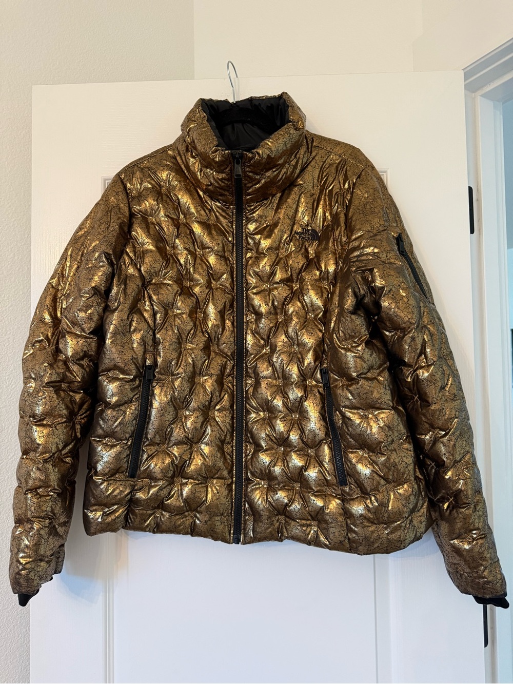 The North Face Women’s Metallic Gold Holladown 550 Quilted Puffer Jacket